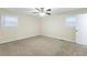 Well-lit bedroom with neutral walls and carpet at 3730 Douglas Ridge Trl, Douglasville, GA 30135