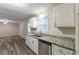 Updated kitchen with granite countertops and stainless steel dishwasher at 3730 Douglas Ridge Trl, Douglasville, GA 30135