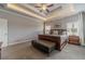 Spacious main bedroom with coffered ceiling, hardwood floors, and an ensuite bathroom at 55 River Meadow Ln, Social Circle, GA 30025