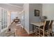 Home office with granite-top desk and built-in shelving at 55 River Meadow Ln, Social Circle, GA 30025