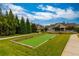 Community bocce ball court with well-manicured lawn and landscaping at 322 Little Pine Ln, Woodstock, GA 30188