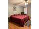 Spacious primary bedroom with king-size bed and hardwood floors at 2111 Hutton Dr, Grayson, GA 30017