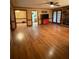 Open living space with hardwood floors and views into kitchen area at 2111 Hutton Dr, Grayson, GA 30017