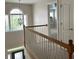 Upper hallway overlooking the entryway with carpeted flooring at 2814 Dominion Nw Ln, Kennesaw, GA 30144