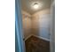 Walk-in closet with wire shelving and carpet flooring at 2814 Dominion Nw Ln, Kennesaw, GA 30144