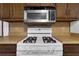 Close-up view of the kitchen's gas stove and microwave at 2763 Macby Walk, Marietta, GA 30066