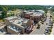 Aerial view of the town center, featuring shops and restaurants at 1164 Chastain Dr # 15, Sugar Hill, GA 30518