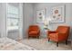 Relaxing sitting area with two orange armchairs at 1164 Chastain Dr # 15, Sugar Hill, GA 30518