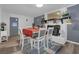 Dining area with a table, chairs, fireplace, and Christmas tree at 2611 Kings Cir, Lawrenceville, GA 30044