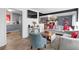 Open living room with kitchen view, featuring hardwood floors and a cozy sitting area at 2611 Kings Cir, Lawrenceville, GA 30044