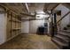 Unfinished basement with laundry and stairs at 2611 Kings Cir, Lawrenceville, GA 30044