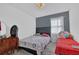 Spacious bedroom with a queen-size bed, twin bed, and plenty of floor space at 2611 Kings Cir, Lawrenceville, GA 30044