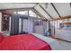Bright bedroom with a red bed and large windows at 2611 Kings Cir, Lawrenceville, GA 30044