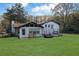 Home's rear view with a large backyard at 2611 Kings Cir, Lawrenceville, GA 30044