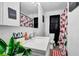 Clean bathroom, featuring a white vanity, shower/tub combo, and updated fixtures at 2611 Kings Cir, Lawrenceville, GA 30044