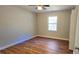 Bedroom with hardwood floors and bay window at 140 Annie Chandler Trl, Lawrenceville, GA 30045