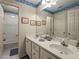 Bathroom with double sinks and shower/tub combo at 2194 Ne Indian Shoals Dr, Loganville, GA 30052