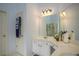 Bathroom with double sinks, vanity, and a large mirror at 2194 Ne Indian Shoals Dr, Loganville, GA 30052