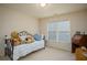 Bedroom with daybed, window, and wooden desk at 2194 Ne Indian Shoals Dr, Loganville, GA 30052