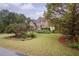 Brick house with large yard and American flag at 2194 Ne Indian Shoals Dr, Loganville, GA 30052