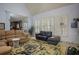 Relaxing living room featuring hardwood floors, vaulted ceilings and comfy seating at 2194 Ne Indian Shoals Dr, Loganville, GA 30052