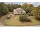 Aerial view of two-story brick house and yard at 2194 Ne Indian Shoals Dr, Loganville, GA 30052