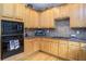 Modern kitchen with black appliances and granite countertops at 2194 Ne Indian Shoals Dr, Loganville, GA 30052