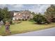 Brick two-story house with landscaped yard at 2194 Ne Indian Shoals Dr, Loganville, GA 30052