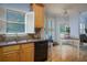 Bright kitchen with granite countertops, wooden cabinetry, and a breakfast nook at 2194 Ne Indian Shoals Dr, Loganville, GA 30052
