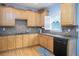 Spacious kitchen with granite countertops and light wood cabinets at 2194 Ne Indian Shoals Dr, Loganville, GA 30052