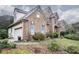 Brick and siding house with landscaped yard at 2194 Ne Indian Shoals Dr, Loganville, GA 30052