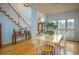 Bright dining room with hardwood floors and a charming table set at 2194 Ne Indian Shoals Dr, Loganville, GA 30052