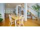 Bright dining room with hardwood floors, view of living room and stairs at 2194 Ne Indian Shoals Dr, Loganville, GA 30052