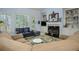 Inviting living room with a fireplace and built-in shelving at 2194 Ne Indian Shoals Dr, Loganville, GA 30052