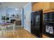 Kitchen features hardwood floors, stainless steel appliances, and a view of the living room at 2194 Ne Indian Shoals Dr, Loganville, GA 30052