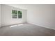 Bright bedroom with carpeted floor and large window at 62 Hampton Ter, Dallas, GA 30157