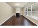 Living room with hardwood floors and a gas fireplace at 6788 Oconee Pl, Fairburn, GA 30213