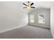 Bright and airy bedroom with carpet and two windows at 2615 Joseph Dr, Cumming, GA 30028