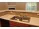 Double sink with tile backsplash and light countertops at 832 Arbor Gate Ln # 832, Lawrenceville, GA 30044