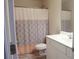 Bathroom with shower/tub and geometric patterned curtain at 832 Arbor Gate Ln # 832, Lawrenceville, GA 30044