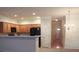 Kitchen with wood cabinets, black appliances, and a breakfast bar at 832 Arbor Gate Ln # 832, Lawrenceville, GA 30044