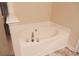 White corner bathtub with chrome fixtures at 832 Arbor Gate Ln # 832, Lawrenceville, GA 30044