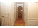 Bright hallway with hardwood floors and neutral walls at 832 Arbor Gate Ln # 832, Lawrenceville, GA 30044