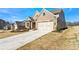 Brick home with a three-car garage and landscaping at 2640 Joseph Dr, Cumming, GA 30028