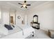 Spacious bedroom with carpeting, ceiling fan, and access to a private bathroom at 2640 Joseph Dr, Cumming, GA 30028