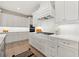 Kitchen with white cabinets, gas range and white subway tile at 2640 Joseph Dr, Cumming, GA 30028