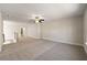 Spacious bonus room with neutral decor, carpeting, and ceiling fan at 2640 Joseph Dr, Cumming, GA 30028
