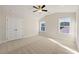 Bright bedroom with double door closet and neutral colored walls at 2640 Joseph Dr, Cumming, GA 30028