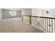 Large bonus room with carpeted floors and views to the main level at 2640 Joseph Dr, Cumming, GA 30028