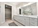 Elegant bathroom with double vanity, large mirror, and walk-in shower at 2640 Joseph Dr, Cumming, GA 30028